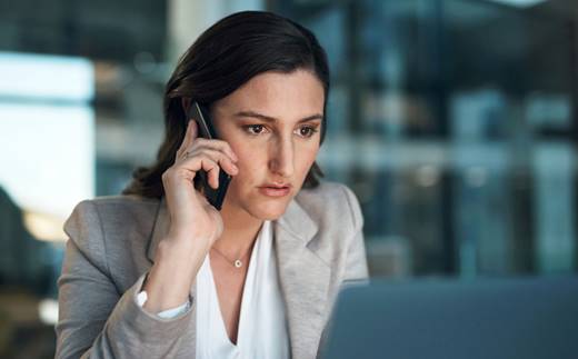 Woman on the phone at work - Whistleblower Protection